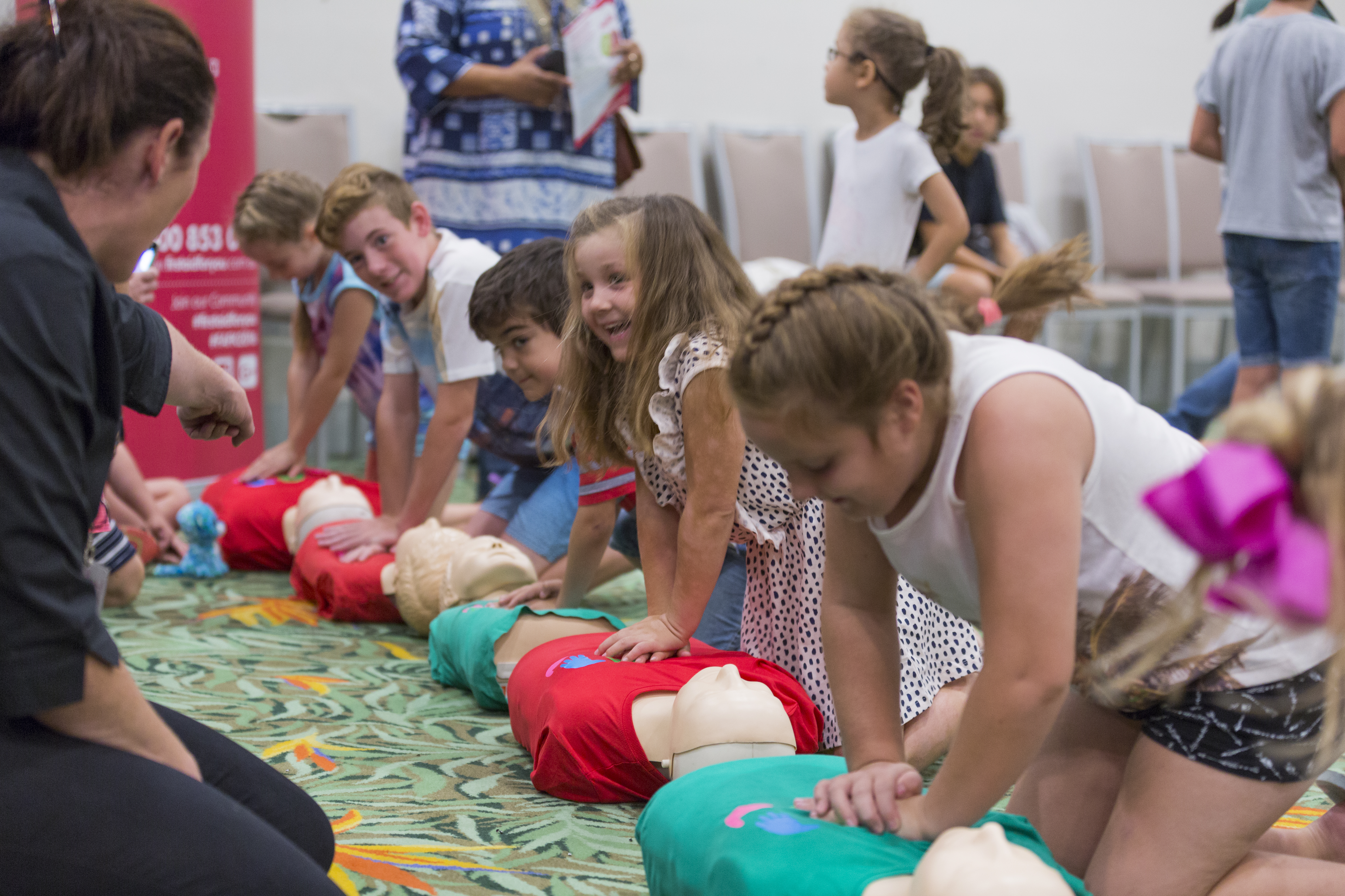 Children/Kids learning CPR with Mary Dawes of First Aid For You