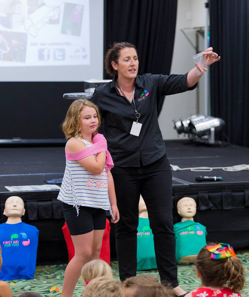 Mary Dawes teaching wound management to children in First Aid For Kids workshop